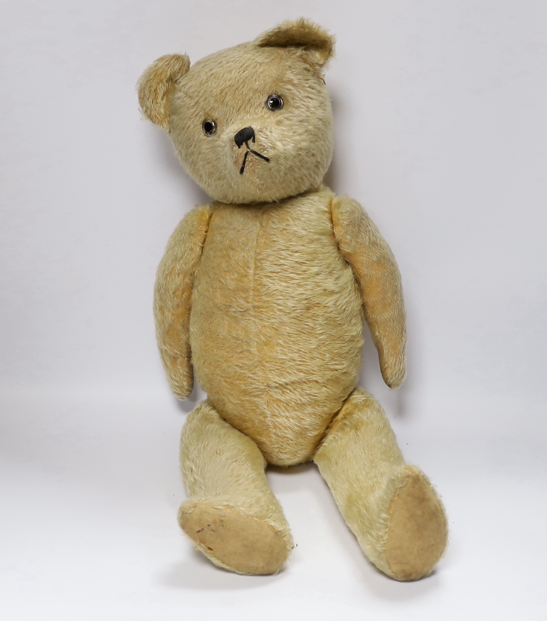 A golden plush bear, worn, 60cm